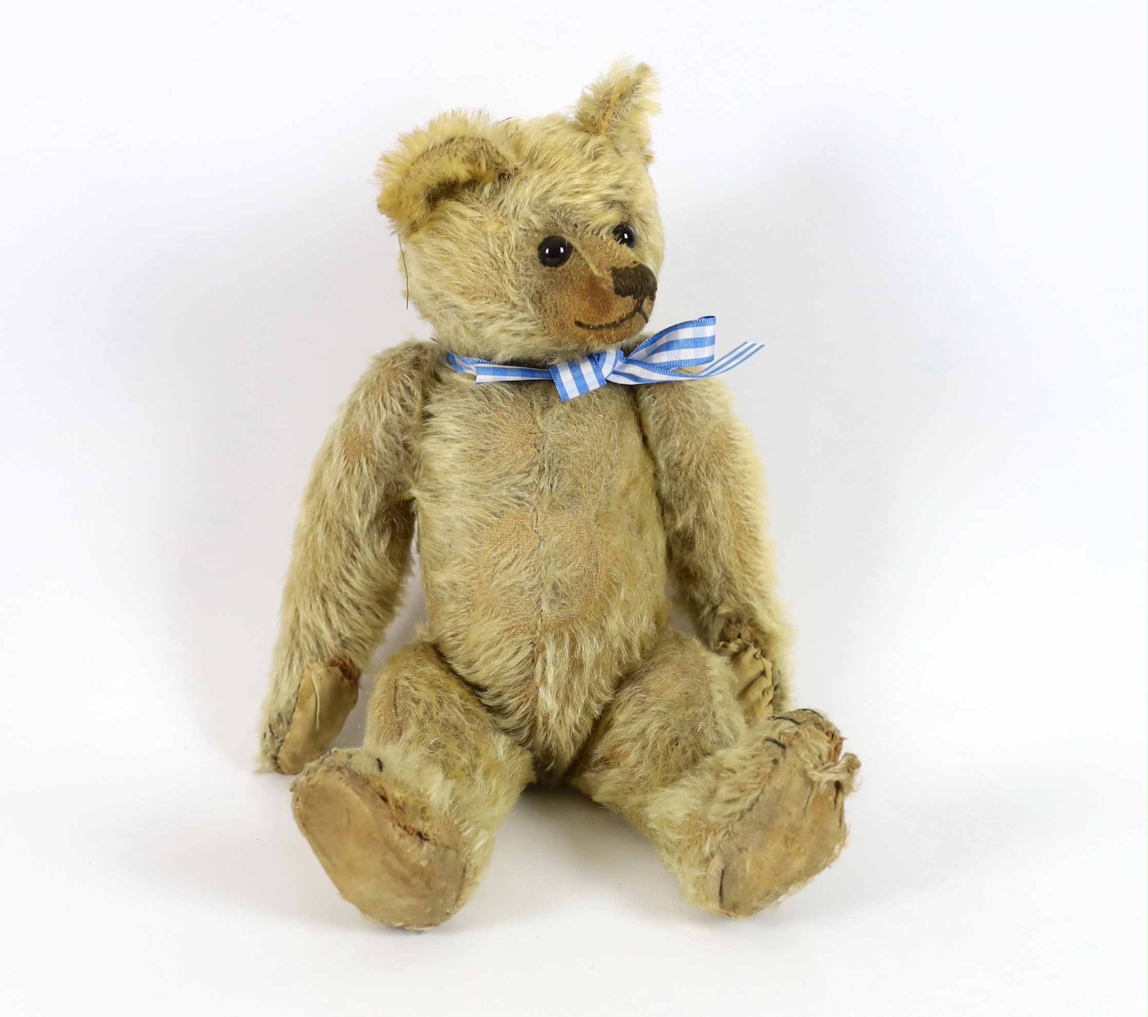 A Farnell bear, c.1912, 33cm, bear paw pads restored, hair loss to stomach